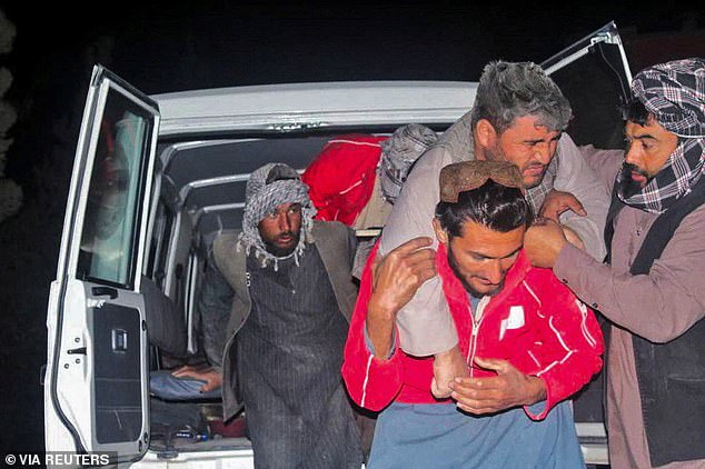 A man is carried out of a vehicle following the powerful, 6.3 magnitude earthquake