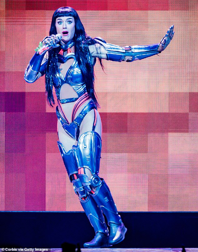 Katy slipped into dazzling bodysuits with matching thigh-high boots as she flaunted her jaw-dropping figure to the packed Unipol Arena