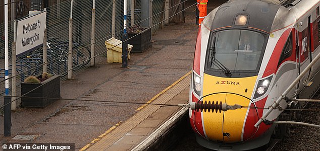 Drivers drive the LNER Azuma train, on which a mass stabbing took place, away from the platform at Huntingdon Station in Huntingdon, eastern England, on November 3, 2025. UK police were working on Sunday to investigate a mass stabbing on a London-bound train that left left nine people in hospital with "life-threatening" wounds. The attack occurred on Saturday evening on the typically busy service between the town of Doncaster, in northern England, and King's Cross Station in the capital. The incident forced the train to stop at Huntingdon station, in Cambridgeshire. Police said the incident left 10 people in hospital, nine of whom were "believed to have suffered life-threatening injuries". (Photo by Chris RADBURN / AFP) (Photo by CHRIS RADBURN/AFP via Getty Images)