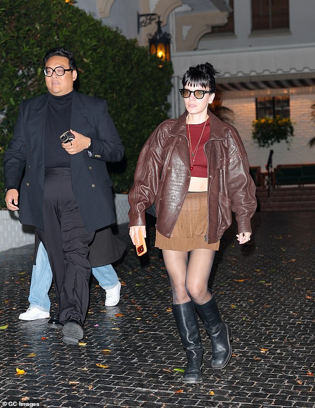 With her good friend, actor Daniel Nguyen by her side, Lily completed her look with a brown leather jacket and sunglasses