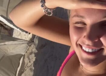 JoJo Siwa shares more sizzling holiday snaps as she strips to a tiny bikini and cosies up to Chris Hughes on a sunbed