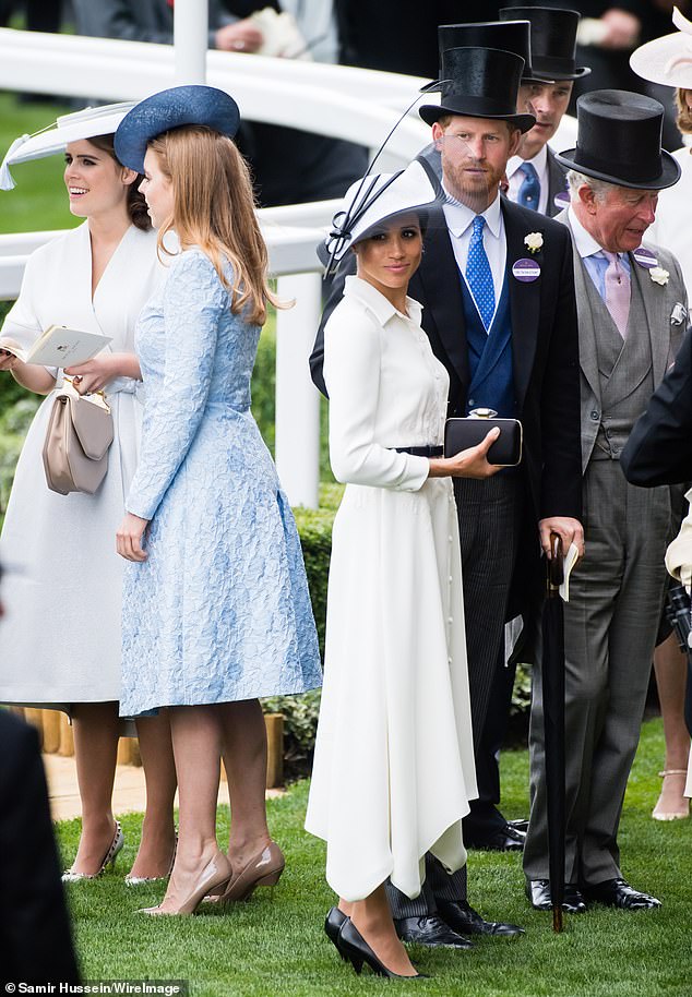 Prince Harry with Charles, then the Prince of Wales, and Meghan Markle, as well as Eugenie (in white, left) and Beatrice (in blue, centre left) at Ascot racecourse in 2018