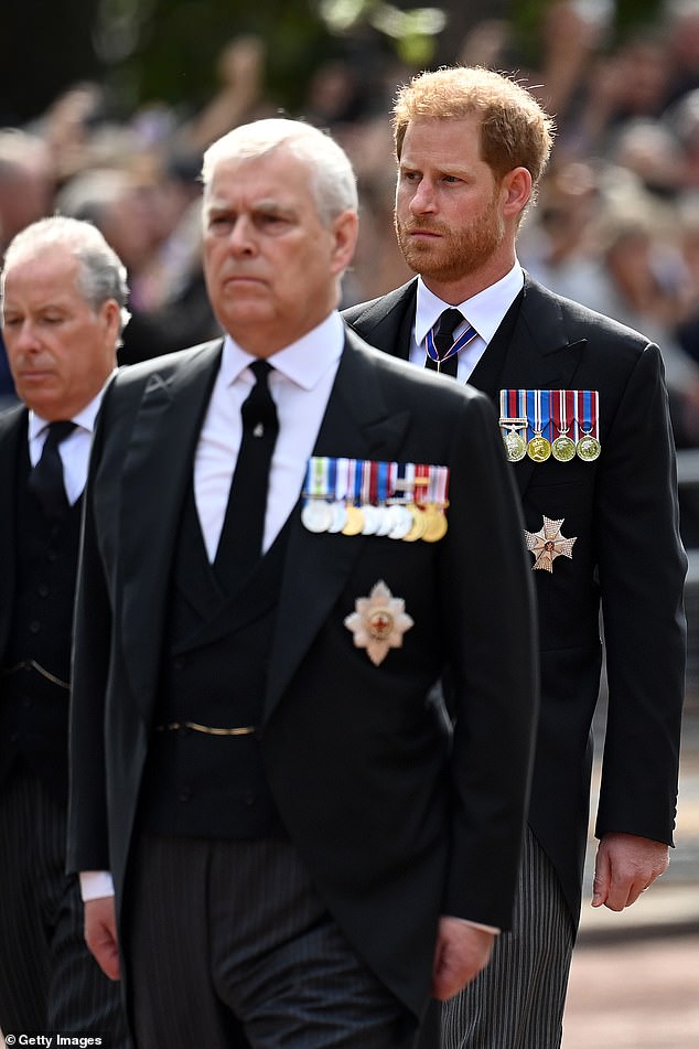 Prince Andrew, Duke of York and Prince Harry, Duke of Sussex, photograhed during the procession for the Lying-in State of Queen Elizabeth II on September 14, 2022