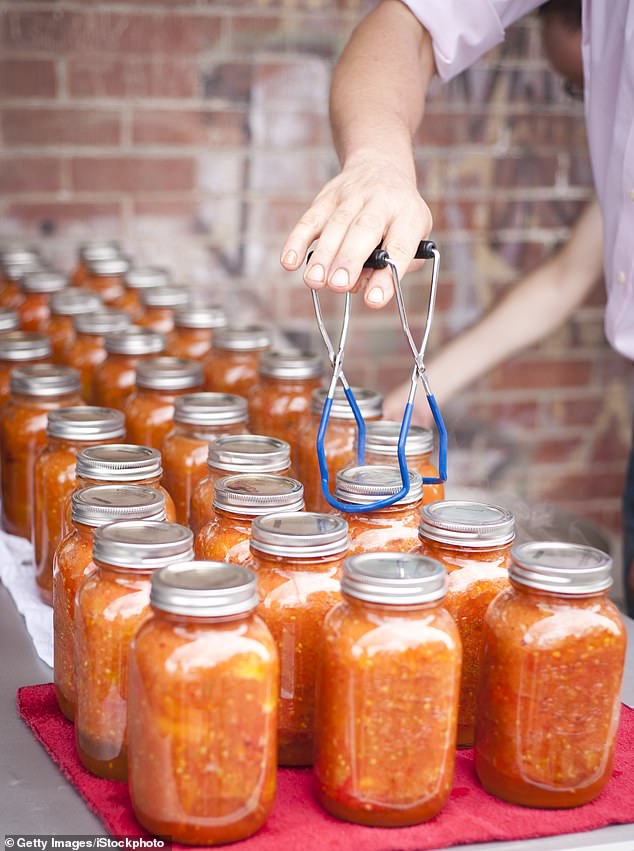 Meghan appeared to be holding the curved end of the lifter - which is specially shaped for lifting jars - instead of the black rubber handles. Stock image displaying correct use of the lifter