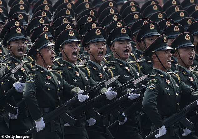 Chinese soldiers shout as they march in formation during a parade to celebrate the 70th Anniversary of the founding of the People's Republic of China at Tiananmen Square in 1949, on October 1, 2019