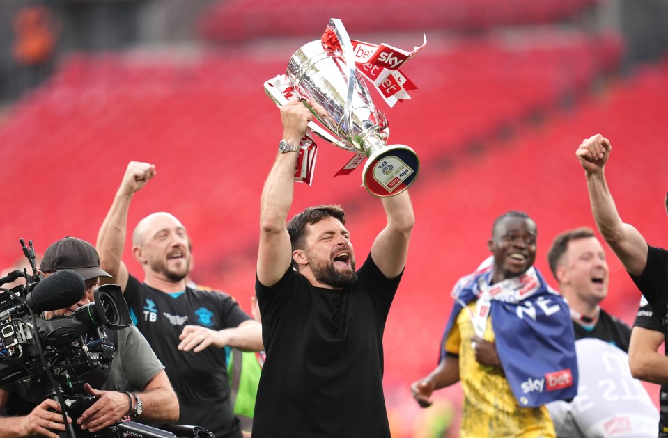 Southampton players celebrate with the Sky Bet Championship Play-Off Final trophy.
