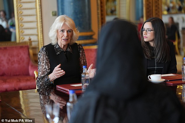 Queen Camilla, Patron of SafeLives meets with young pioneer 'Changemakers', and staff from the SafeLives charity, at Buckingham Palace