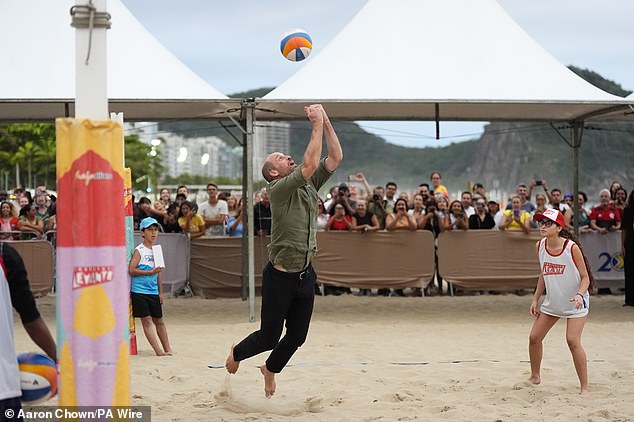 The heir to the throne threw himself around on the sand alongside Olympic star Carolina Solberg who runs a local beach volleyball school for disadvantaged children