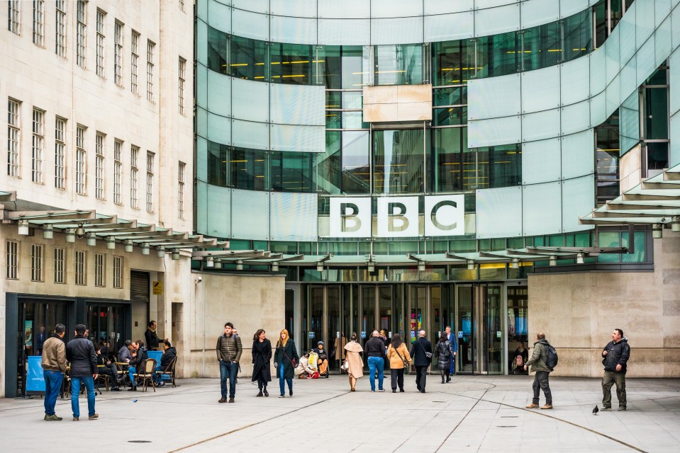 People outside the main entrance to the BBC's Broadcasting House in central London.