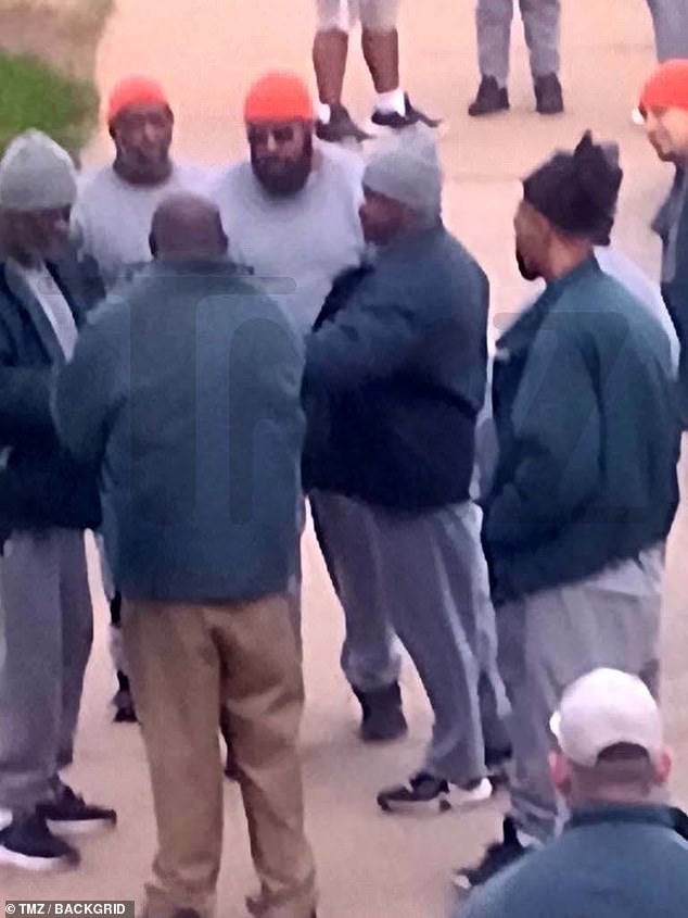 Telfair (right) was seen hanging out with Diddy and a group of fellow convicts in a prison yard