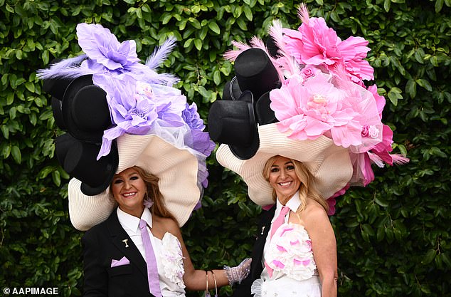 Racegoers on arrival to Flemington Racecourse ahead of the 2025 Melbourne Cup at Flemington in Melbourne, Tuesday, November 4, 2025. (AAP Image/Joel Carrett) NO ARCHIVING, EDITORIAL USE ONLY