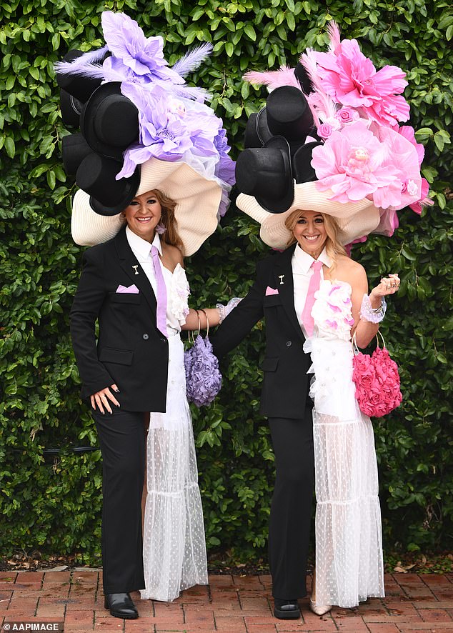 Racegoers on arrival to Flemington Racecourse ahead of the 2025 Melbourne Cup at Flemington in Melbourne, Tuesday, November 4, 2025. (AAP Image/Joel Carrett) NO ARCHIVING, EDITORIAL USE ONLY