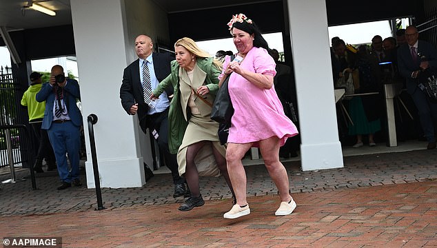 Racegoers run for position following the  gates opening to the 2025 Melbourne Cup Day at Flemington Racecourse in Melbourne, Tuesday, November 4, 2025. (AAP Image/James Ross) NO ARCHIVING, EDITORIAL USE ONLY