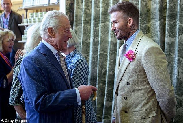 David Beckham wearing a David Austin Roses 'King's Rose' speaks with King Charles, patron of the Royal Horticultural Society, during a visit to the RHS Chelsea Flower Show at Royal Hospital Chelsea on May 20, 2025