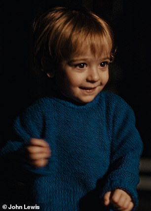 The ad soon cuts from the dad dancing in the club, filmed in Electric Brixton , in London, to flashbacks showing him remembering his son as a toddler and a baby in the '90s (pictured)