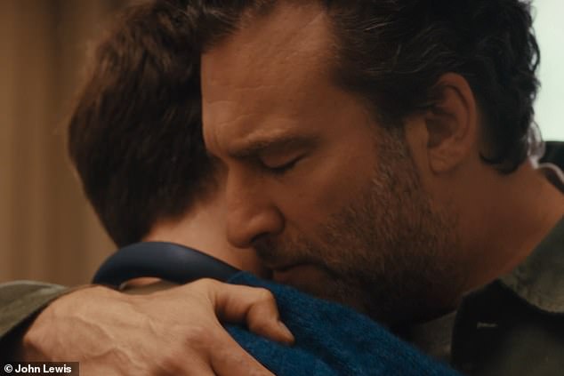 Then, as Labrinth¿s new version of the track echoes softly in the background, the scene shifts back to the present day, where the slightly embarrassed teen is pulled into an embrace by his emotional dad