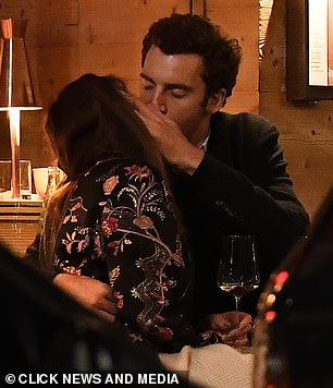 The lovebirds wrapped up warm as they dined alfresco in a swanky restaurant and enjoyed cocktails