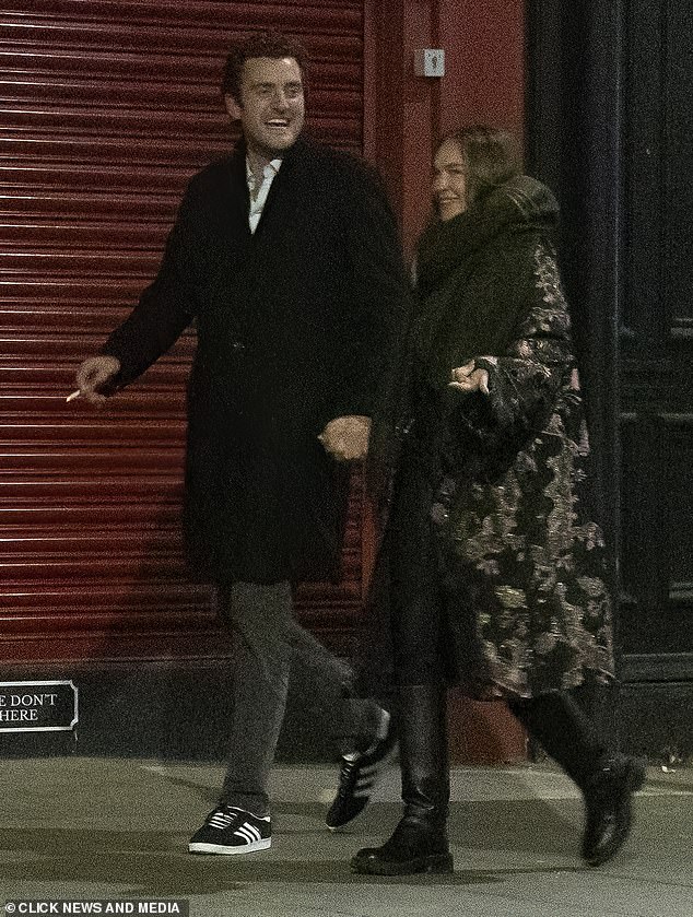 They later strolled hand-in-hand down the street