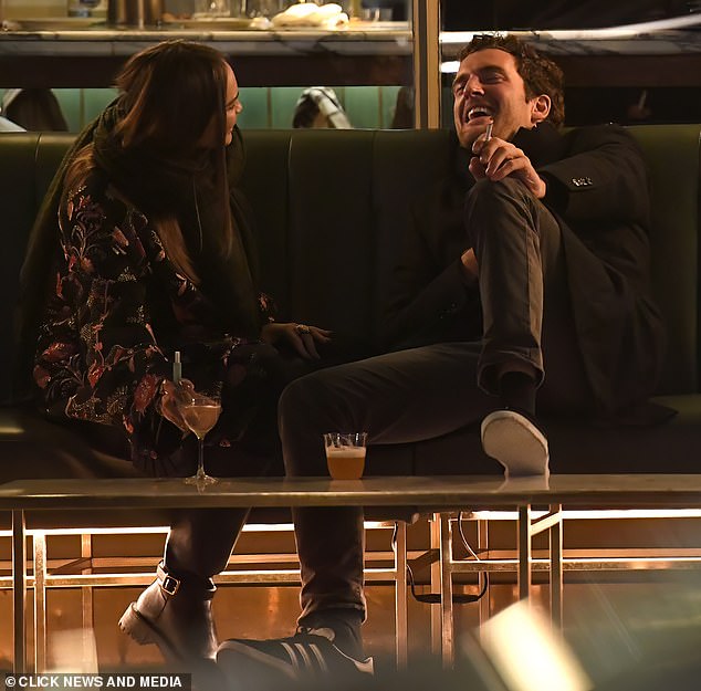 Together they puffed on cigarettes while chatting and sharing a giggle