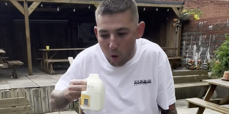 Watch darts star Nathan Aspinall retch and vomit after being forced to do disgusting fantasy football forfeit