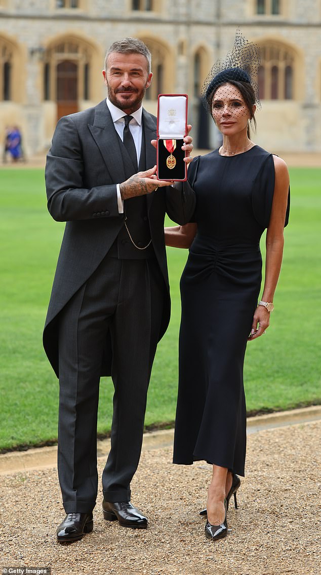 The fashionista looked stunning in the £850 Bela Midi Dress in black with a nipped in waist and asymmetric sleeves to show off her extremely toned arms