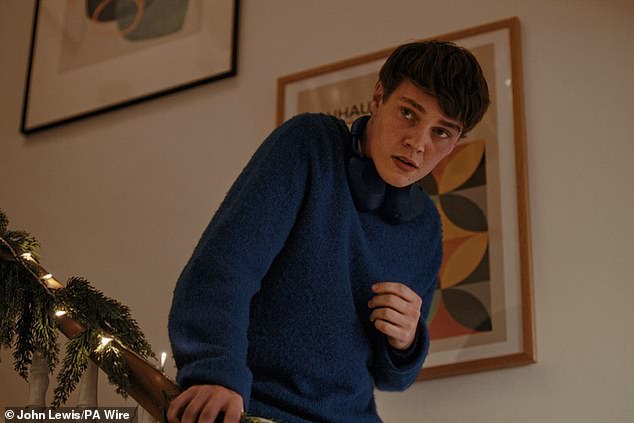 Then, as a modern version of the track echoes softly in the background, the scene shifts back to the present day, where the embarrassed teen anxiously watches his father's reaction