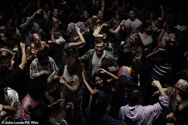 This year's John Lewis ad sees a dad transported back to a sweaty, overcrowded nightclub (pictured) after being gifted a vinyl by his teen son
