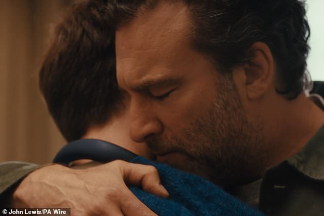 The pair share a quiet moment before the man starts dancing again, forcing a laugh from the teenager