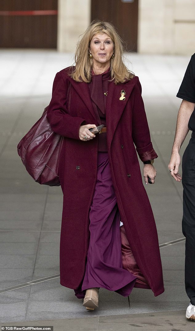 Kate Garraway also looked wind swept as she arrived