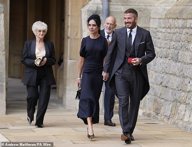 Sir David beamed as he greeted members of the press during Tuesday's investiture