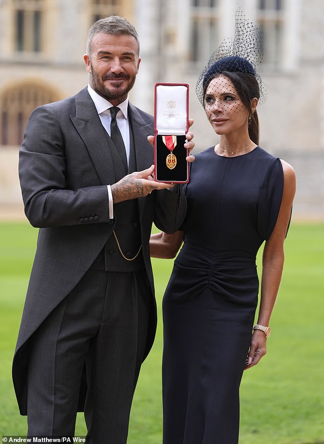 Victoria appeared to hold back tears as she stood alongside her newly honoured husband