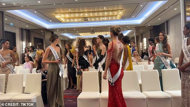 Nawat could be heard shouting 'Stop, stop' as the beauty queens began making their way out of the room. Nawat then tells them to 'Sit down'