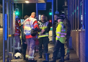Bomb squad called to 'suspicious' suitcase left on railway footbridge as train station & nearby homes evacuated