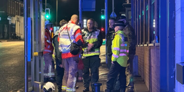 Bomb squad called to 'suspicious' suitcase left on railway footbridge as train station & nearby homes evacuated