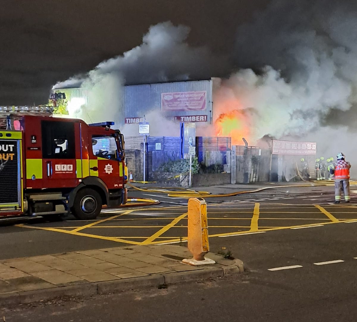 Dozens of firefighters battle huge industrial blaze as major tunnels shut and football fans told 'stay away'