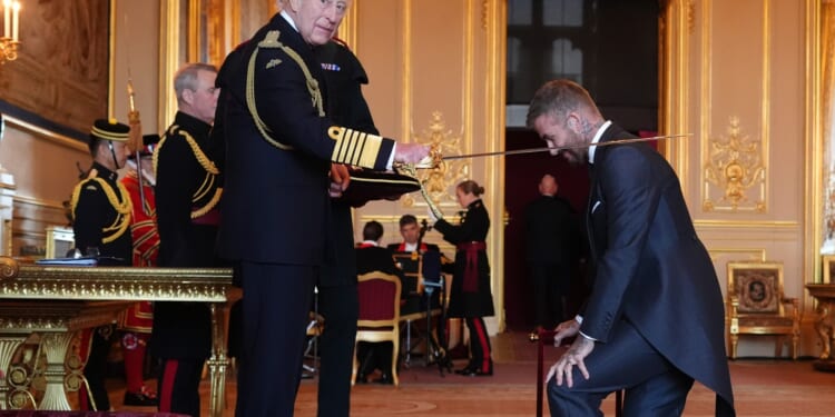 Tearful David Beckham opens up to The Sun on 'surreal' honour of being knighted by King after humble upbringing