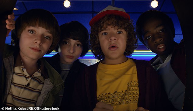 The actor, 23, shot to global stardom at just 14 years old when he was cast as Dustin Henderson in the hugely popular Netflix show (seen with Noah Schnapp, Finn Wolfhard and Caleb McLaughlin on the show)