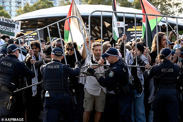 Protesters and NSW Police clashed during an attempted blockade by the Palestine Action Group of the Indo-Pacific Weapons expo at the ICC Sydney on Tuesday