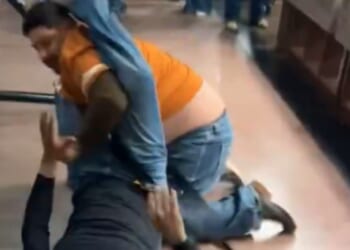 Shock moment brawl erupts at Bass Pro Shop as middle-aged men throw fists, kick each other and onlookers stand aghast