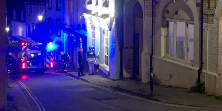 Body found in wreckage of horror house fire as four boys and a girl arrested for arson