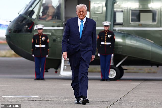 U.S. President Donald Trump walks from Marine One to board Air Force One to depart Haneda Airport for South Korea, in Tokyo, Japan, October 29, 2025