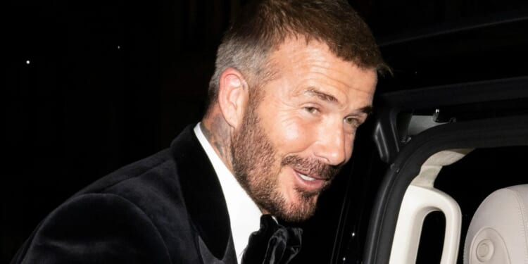 Sir David Beckham celebrates his knighthood with proud wife Victoria as he parties with kids and Gordon Ramsay