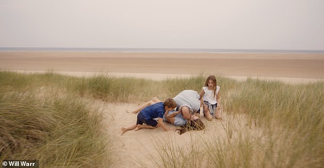 The video featured Kate and her family frolicking in the sand dunes on a Norfolk beach