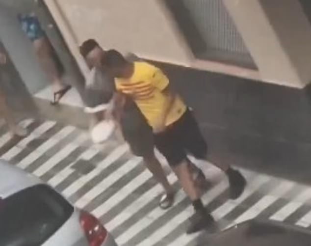 Footage emerged of Nasraoui (yellow Barcelona shirt) being led away after an apparent confrontation with members of the community in the hours leading up to the fight