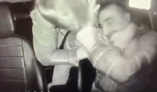 The Brit moved his body forward through the seats for greater range, grabbing the driver's face with one hand and keeping him in a lock with the other