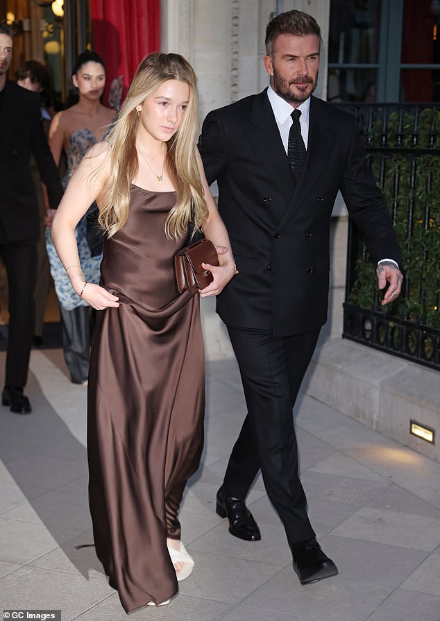 Harper opted for a brown satin variation on the same theme while attending Paris Fashion Week with her father on March 7