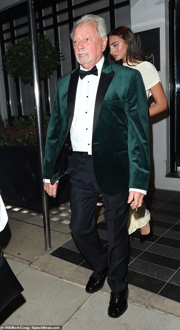 Anthony coordinated with his son-in-law in his own velvet jacket, standing out in the vivid green shade