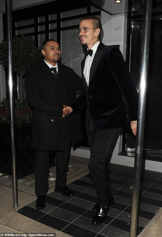 Romeo, who matched his dad in a classic tux couldn't hide his smile, shaking hands with a doorman as he departed
