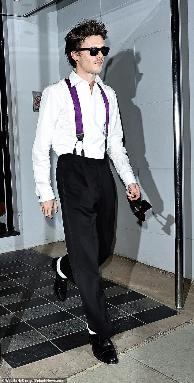 Cruz channelled his parent's confident sense of style, stepping out in bold purple braces and shades