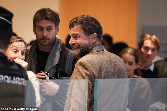 Bertrand Scholler arrives for his trial with nine other persons accused of sexist cyber-harassment of Brigitte Macron